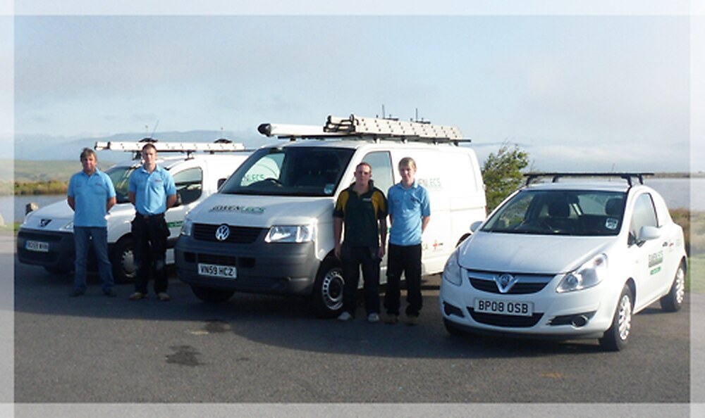 The Gwenlecs Electrical Services team standing beside their three company vans